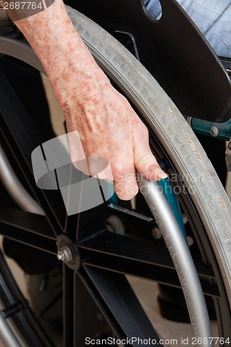 Image of Hand On Wheelchair