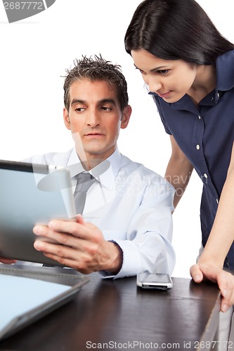 Image of Businessman And Businesswoman At Work