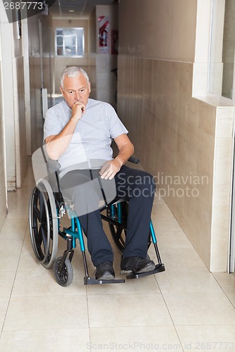 Image of Sad Senior Man Sitting In a Wheelchair