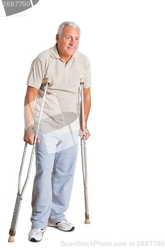 Image of Senior Man On Crutches Looking Away