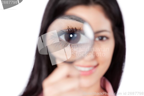 Image of Woman Holding Magnifying Glass