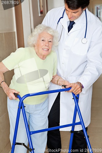 Image of Senior Woman Being Assisted By Doctor