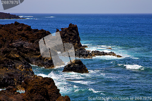 Image of  rock spain  sky light  beach    landscape    cloud   