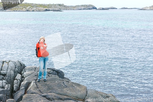 Image of Woman hiker gesturing thumbs up