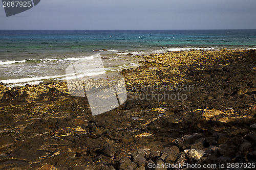 Image of water  in lanzarote  isle foam rock   landscape  stone   cloud 