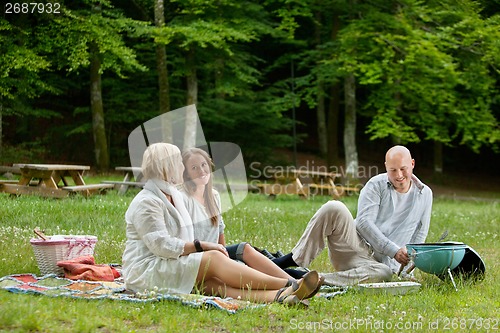 Image of Friends Having Barbecue Picnic Outdoor