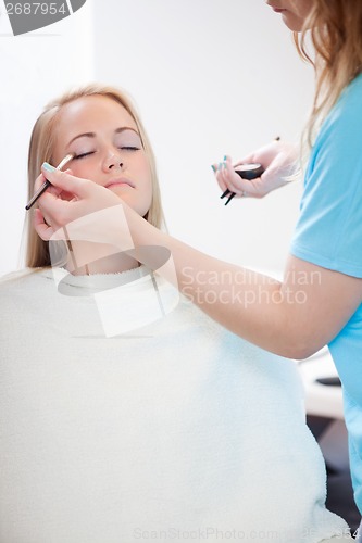 Image of Woman Applying Eyeshadow with Brush