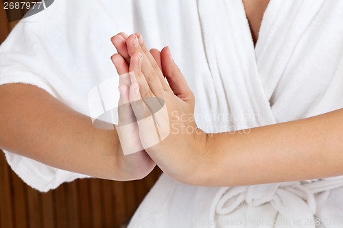 Image of Woman Meditating With Hands Clasped