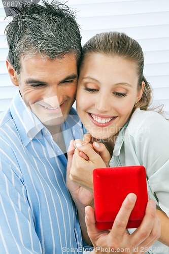 Image of Man Proposing Happy Woman