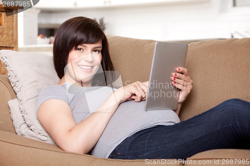 Image of Pregnant Woman with Digital Tablet