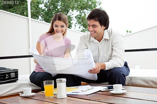 Image of Female Looking At House Plan