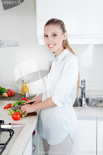 Image of Woman Slicing Vegetables