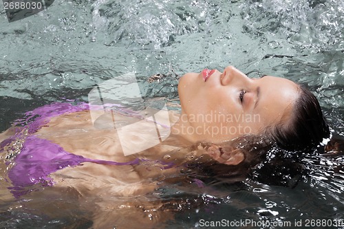 Image of Female Relaxing In Jacuzzi