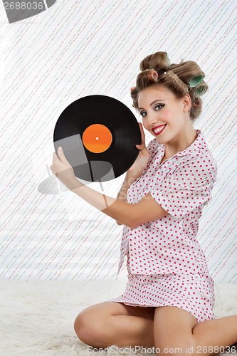 Image of Beautiful Woman Holding Vinyl Record