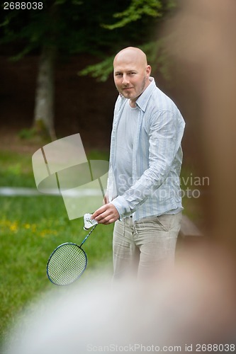 Image of Man Playing Badminton In Park