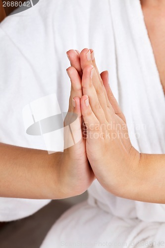 Image of Female Meditating With Hands Clasped