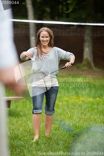 Image of Young Female Playing Badminton