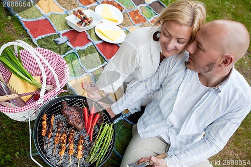 Image of Happy Couple with BBQ in Park