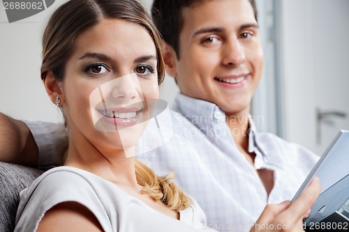 Image of Young Woman Holding Tablet PC