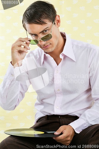 Image of Man Holding Vinyl Record