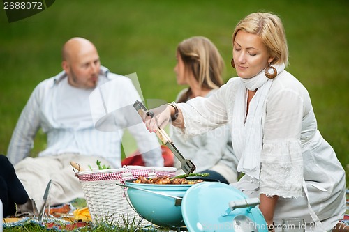 Image of Friends BBQ Picnic in Park