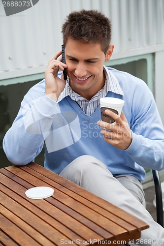 Image of Man On A Call At Cafe