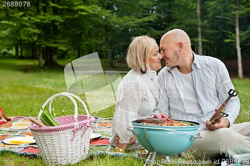 Image of Loving Couple On An Outdoor Picnic