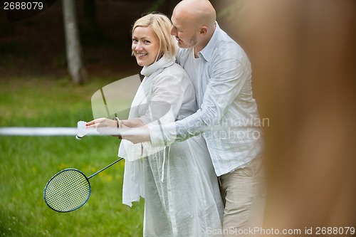 Image of Couple Playing Badminton Together