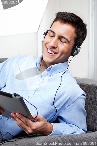 Image of Relaxed Young Man on Couch