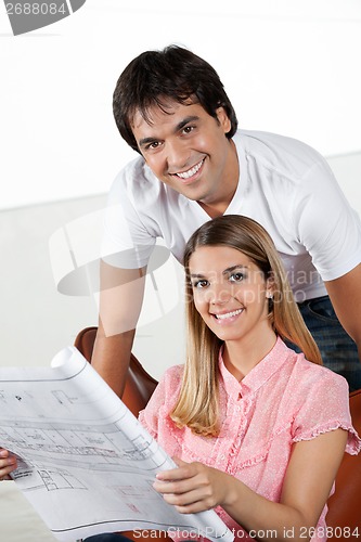 Image of Couple With Blueprint