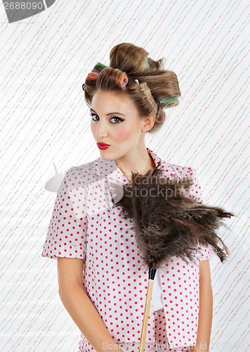 Image of Woman Holding an Ostrich Feather Duster