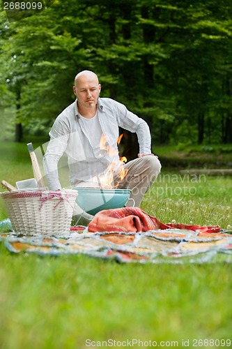 Image of Man At An Outdoor Picnic