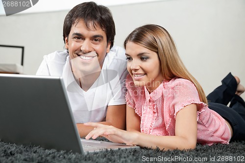 Image of Couple Using Laptop