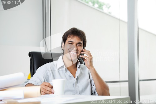 Image of Happy Architect On Phone Call