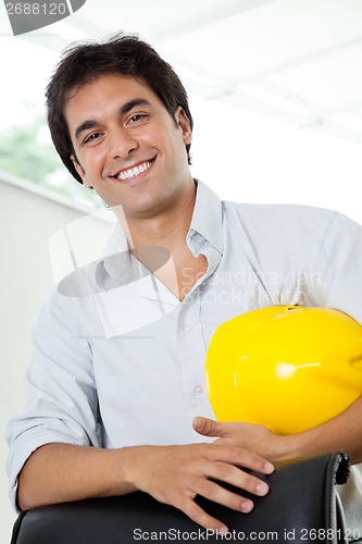 Image of Architect Holding Hardhat