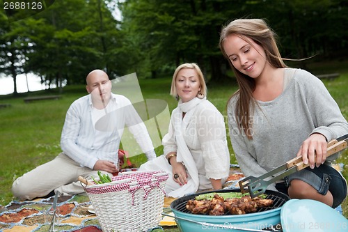 Image of Group of Friends in Park with BBQ