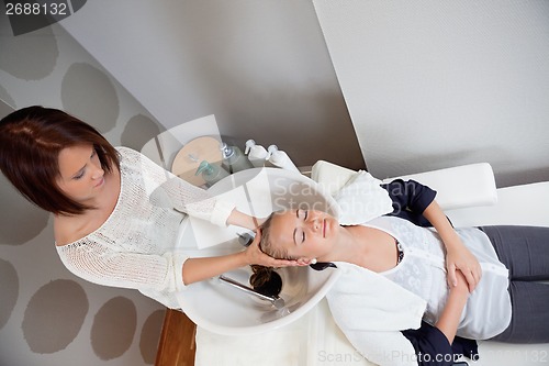 Image of Woman Receiving Head Massage in Beauty Salon