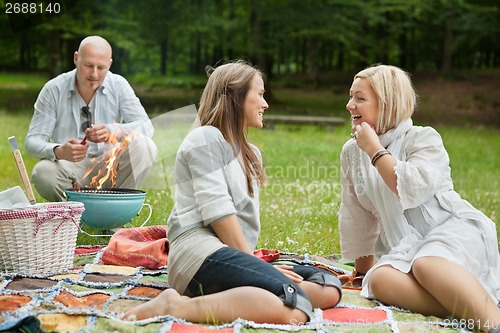 Image of Happy Friends On An Outdoor Picnic