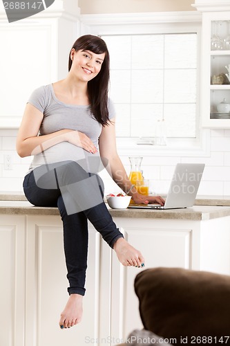Image of Pregnant Woman in Kitchen