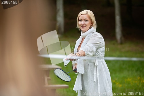 Image of Beautiful Woman Playing Badminton
