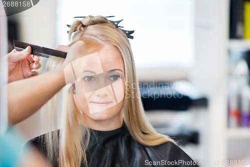 Image of Woman Getting Hair Combed