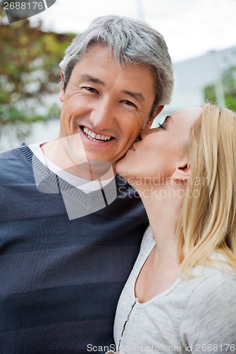 Image of Woman Kissing Man