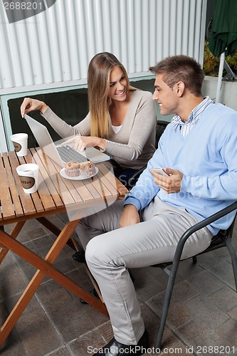 Image of Woman Pointing At Laptop