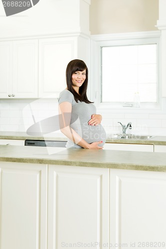 Image of Pregnant Woman in Kitchen