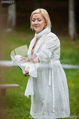 Image of Woman Playing Badminton In Park