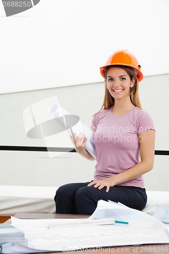 Image of Female Architect With Blueprint