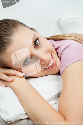 Image of Woman Relaxing On Sofa