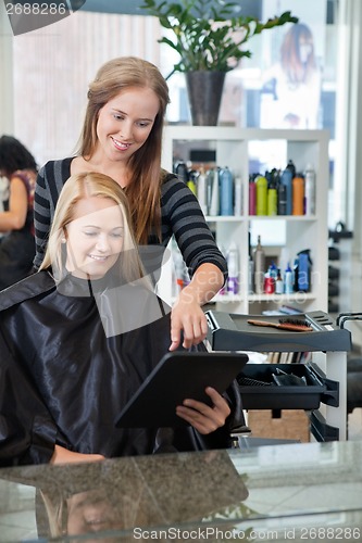 Image of Woman Using Digital Tablet At Parlor