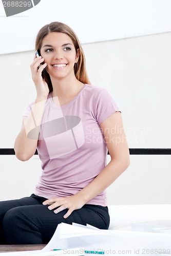 Image of Female Architect Using Cell Phone