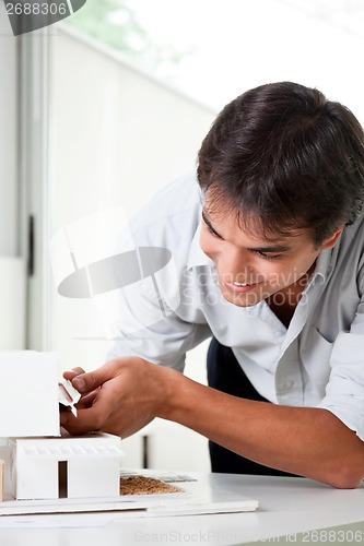Image of Architect Building a House Model